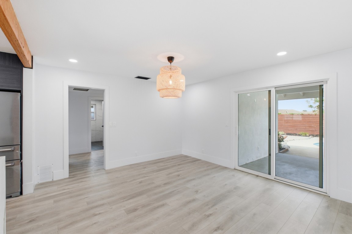Dining area — rattan pendant, slider to the backyard